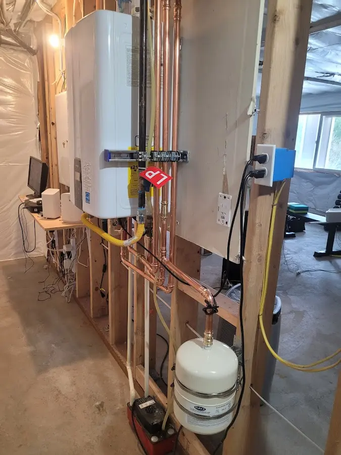 Licensed plumber repairing a kitchen sink in Brookhaven
